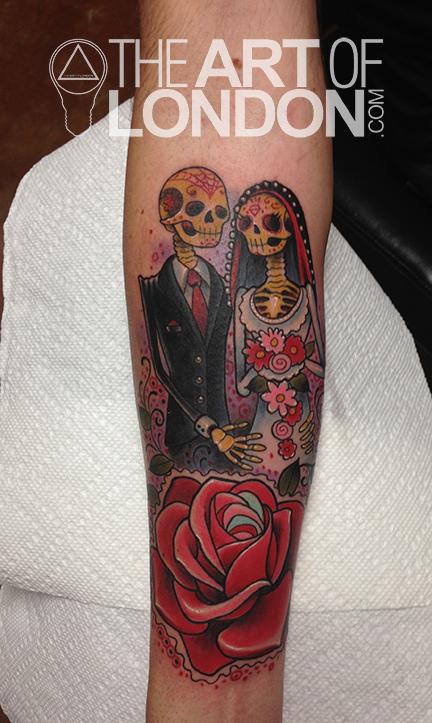 Colorful Dia De Los Muertos Skeleton Couple With Rose Tattoo On Forearm