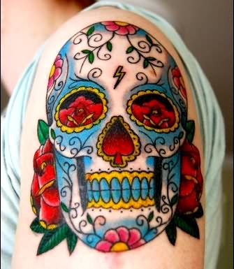 Colorful Dia De Los Muertos Skull With Flowers Tattoo On Left Shoulder