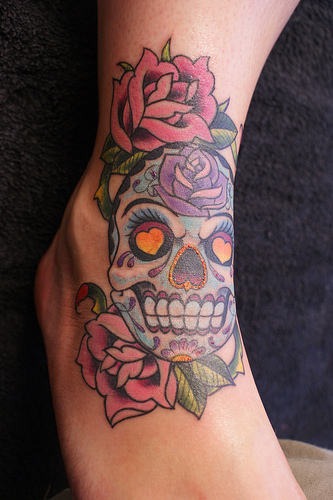 Colorful Dia De Los Muertos Skull With Roses Tattoo On Foot