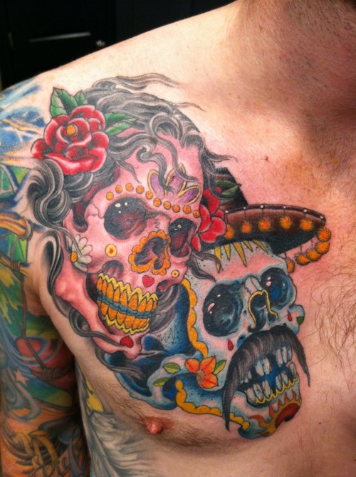 Colorful Dia De Los Muertos Two Skull Tattoo On Man Chest