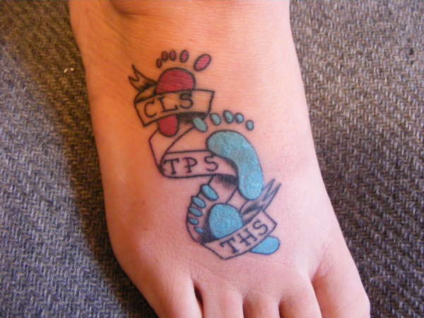 Colorful Footprints With Banner Tattoo On Foot