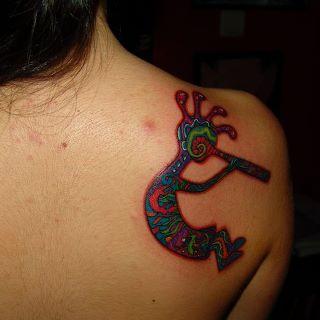 Colorful Kokopelli Tattoo On Girl Right Back Shoulder
