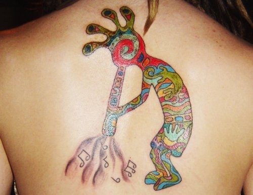 Colorful Kokopelli Tattoo On Upper Back