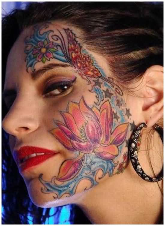 Colorful Lotus Flower Tattoo On Face And Forehead