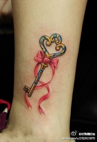 Cool Key With Ribbon Bow Tattoo Design For Wrist
