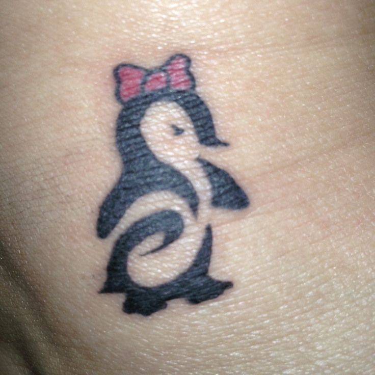 Cute Tribal Penguin With Bow On Head Tattoo