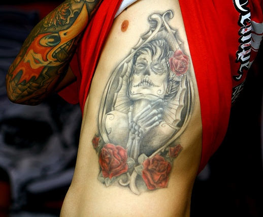 Dia De Los Muertos Pin Up Girl In Frame With Roses Tattoo On Side Rib