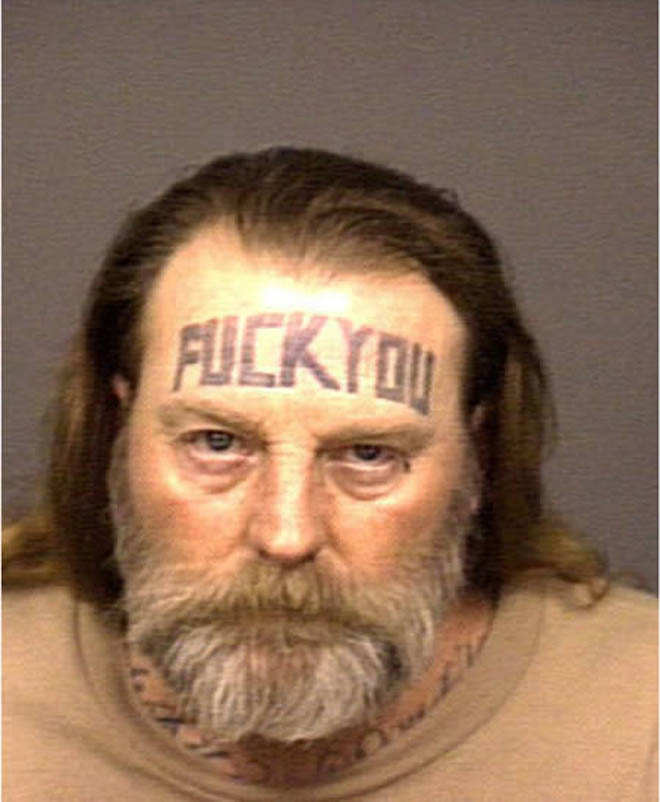 Fuck You Tattoo On Man Forehead