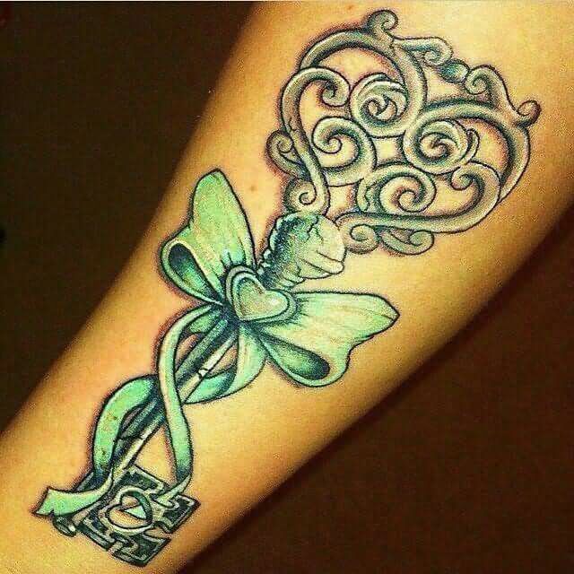 Green Ink Key With Ribbon Tattoo Design For Forearm