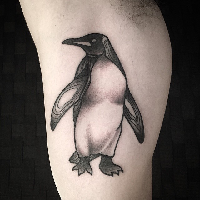 Grey Ink Penguin Tattoo On Bicep