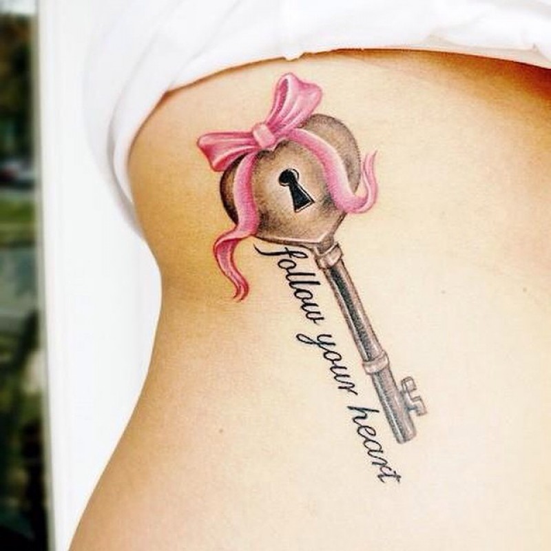 Heart Key And Ribbon Bow With Words Tattoo On Side Rib