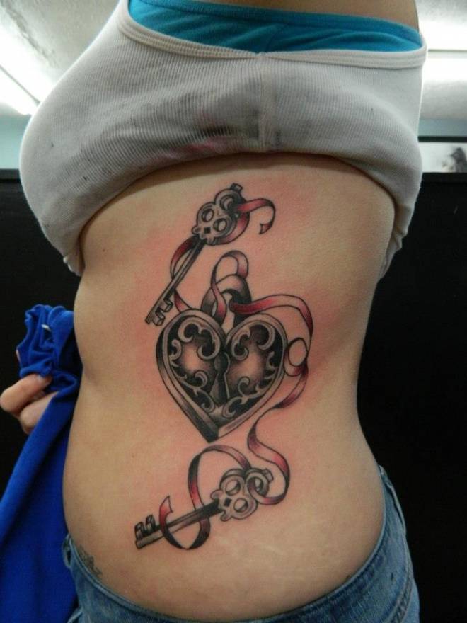 Heart Lovk With Two Skull Key And Ribbon Tattoo On Girl Side Rib