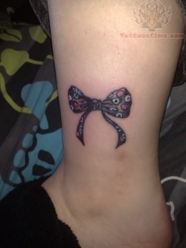 Inspiring Ribbon Bow Tattoo On Leg