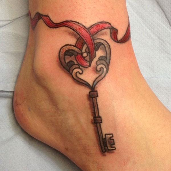 Key With Ribbon Tattoo On Ankle