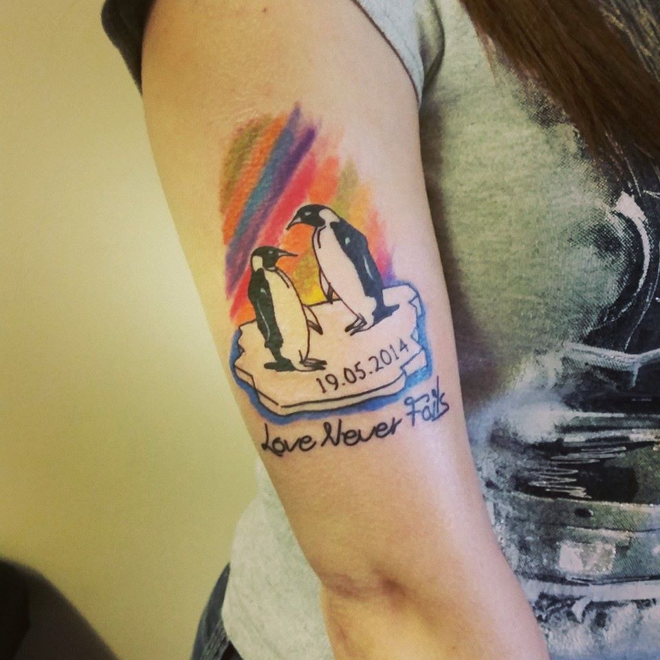 Memorial Penguin Tattoo On Girl Right Bicep