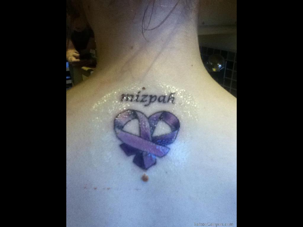 Mizpah - Purple Ink Ribbon Tattoo On Upper Back