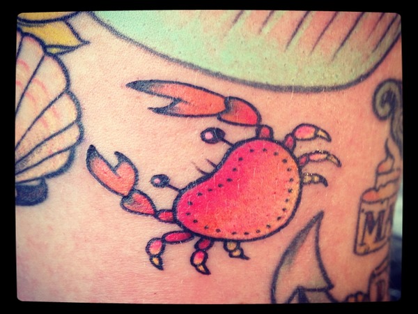 Orange And Red Ink Crab Tattoo