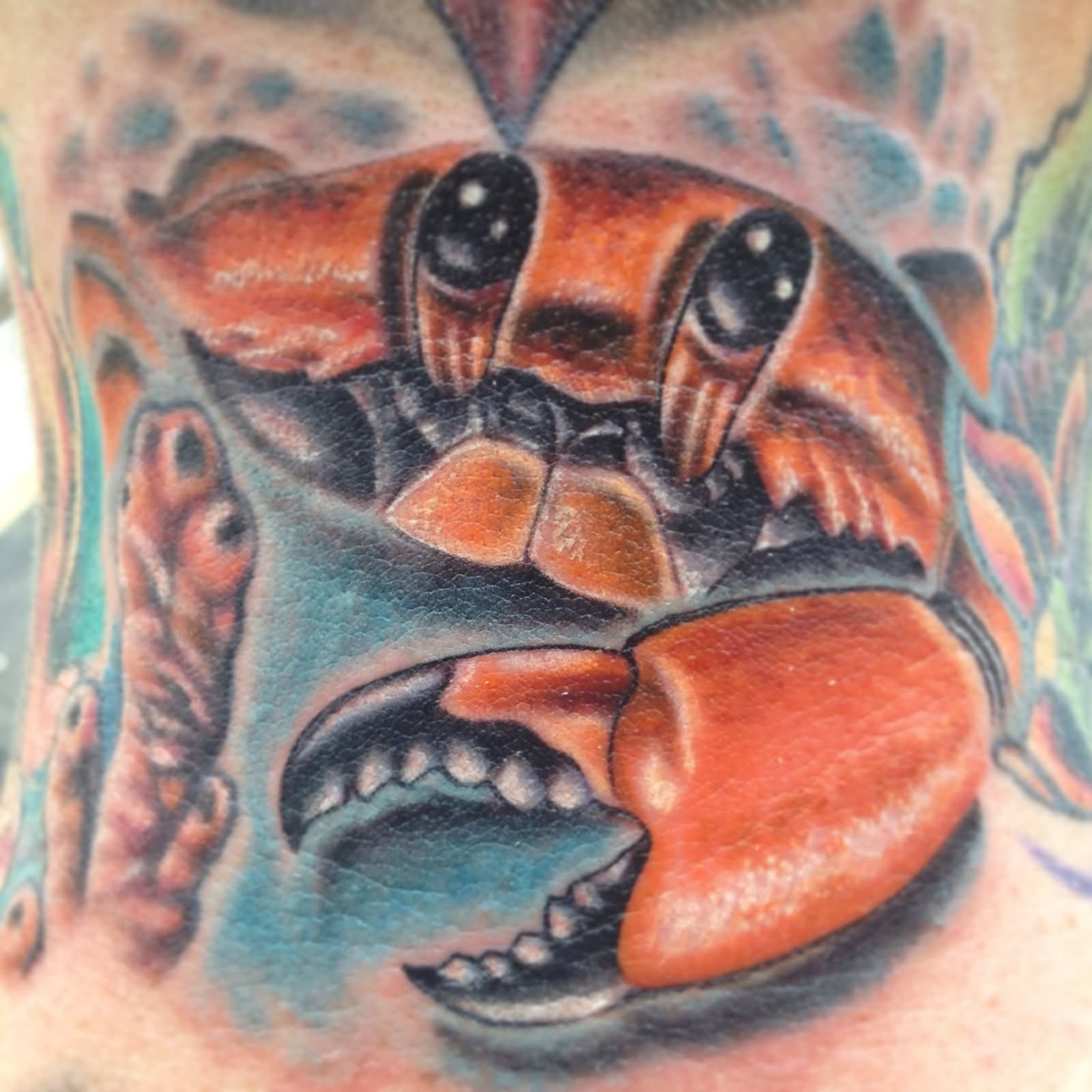 Orange Ink Crab Tattoo On Nape
