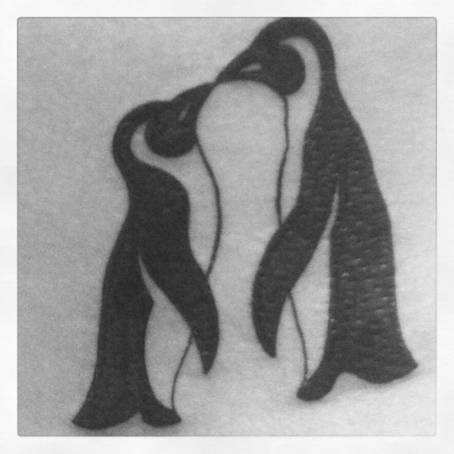 Outline Black And White Kissing Penguin Tattoo