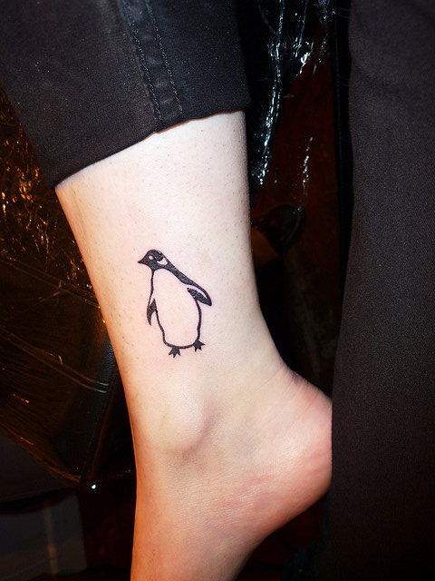 Outline Penguin Tattoo On Leg