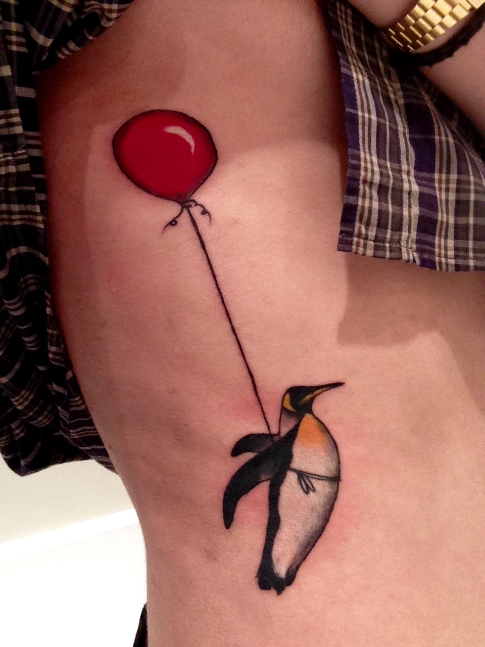 Penguin Flying With Balloon Tattoo On Side Rib