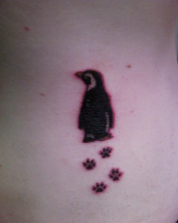 Penguin With Paw Prints Tattoo
