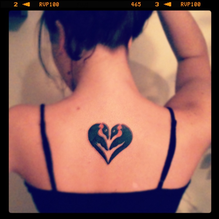 Penguins In Heart Shape Tattoo On Girl Upper Back