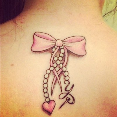 Pink Ribbon Bow With Rosary Heart Tattoo On Upper Back