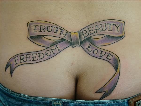 Purple Ribbon Bow With Words Tattoo On Lower Back