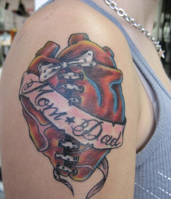 Real Heart With Scroll Banner Tattoo On Right Shoulder