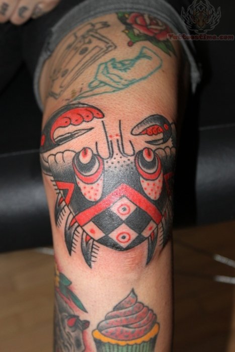 Red And Black Crab Tattoo On Leg