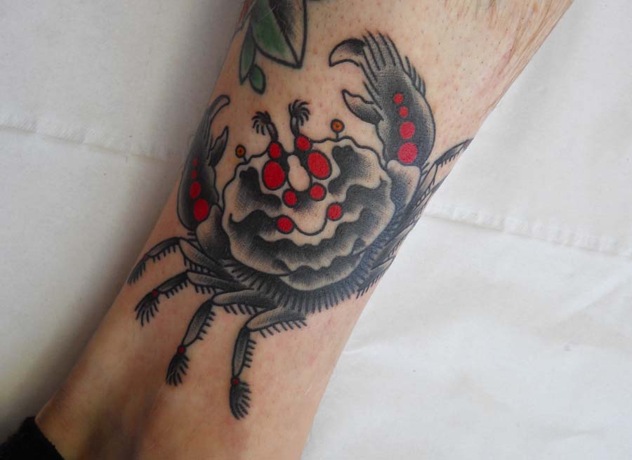 Red And Black Ink Crab Tattoo On Leg