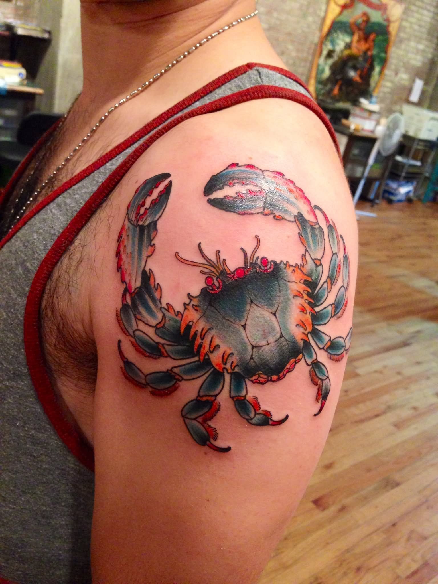 Red And Blue Ink Crab Tattoo On Left Shoulder