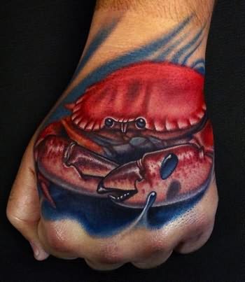 Red Ink Crab Tattoo On Left Hand