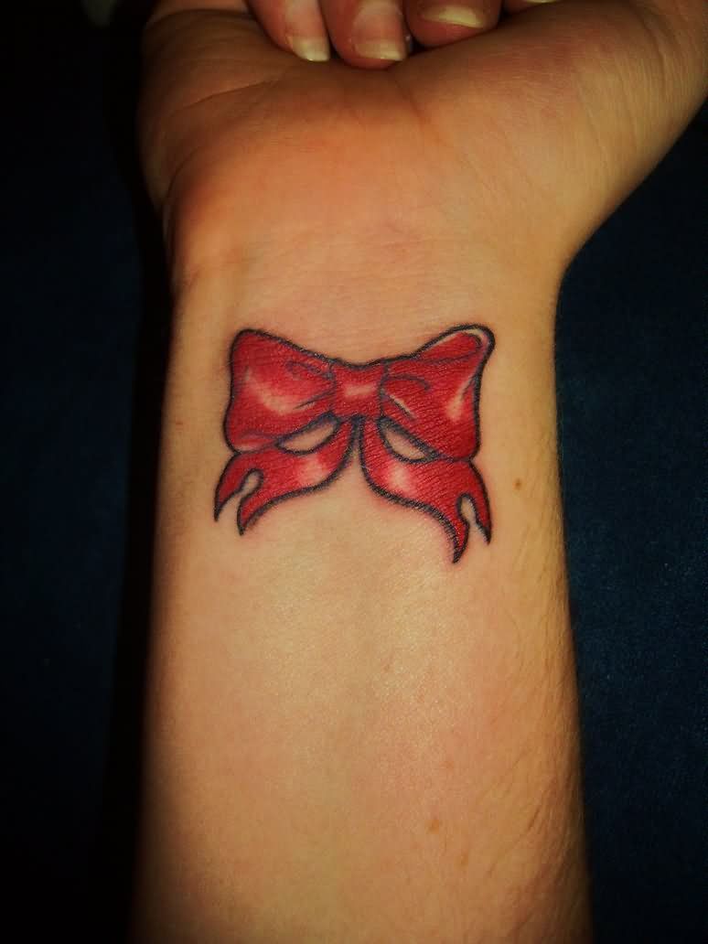 Red Ribbon Bow Tattoo On Wrist