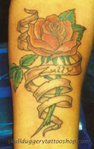 Red Rose With Scroll Ribbon Tattoo Design For Forearm