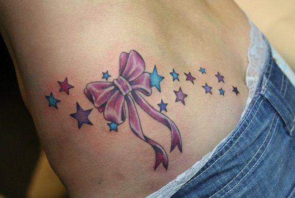Ribbon Bow With Stars Tattoo On Lower Back