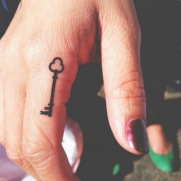 Simple Black Key Tattoo On Girl Finger