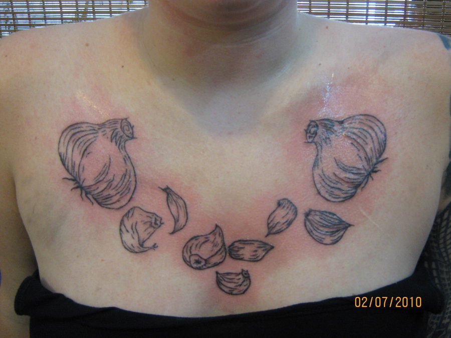 Simple Garlic Tattoo On Girl Chest