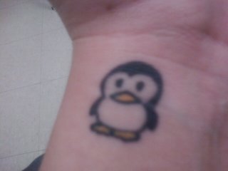 Simple Penguin Tattoo On Wrist