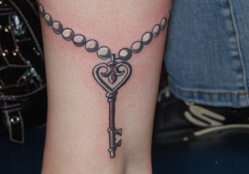 Simple Rosary Key Tattoo Design For Leg