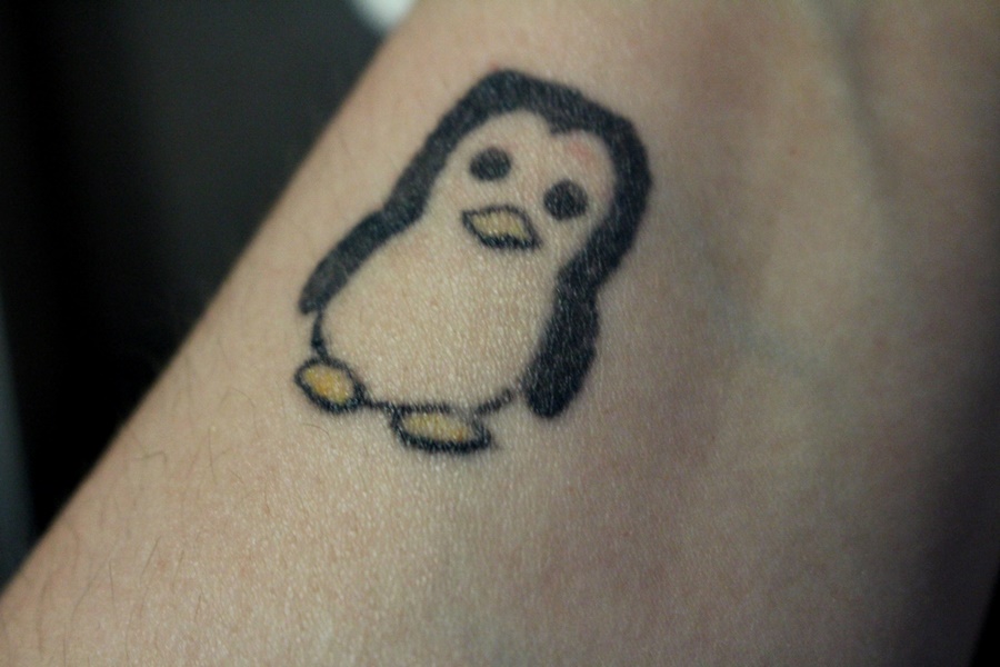Small Cartoon Penguin Tattoo