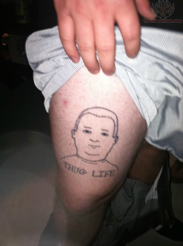 Thug Life – Black Outline Face Tattoo On Thigh