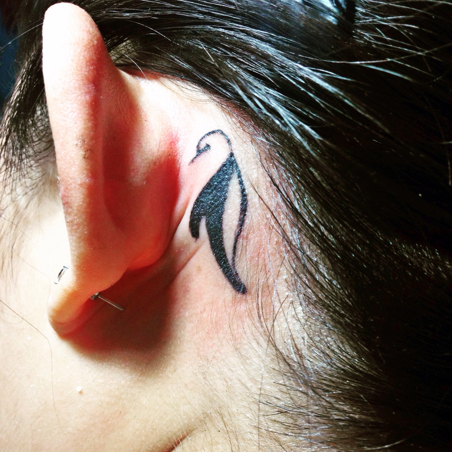 Tribal Penguin Tattoo Behind The Ear