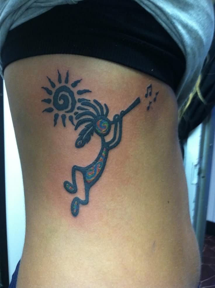 Tribal Sun And Kokopelli Tattoo On Girl Side Rib