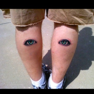 Two Eyes Tattoo On Both Leg Calf