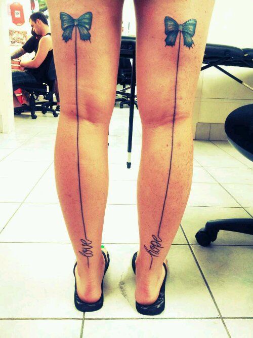 Two Ribbon Bow Tattoo On Both Back Leg