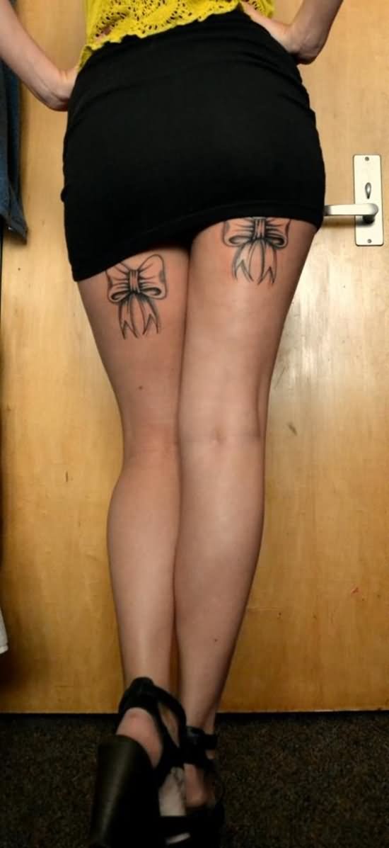 Two Ribbon Bow Tattoo On Girl Both Back Leg