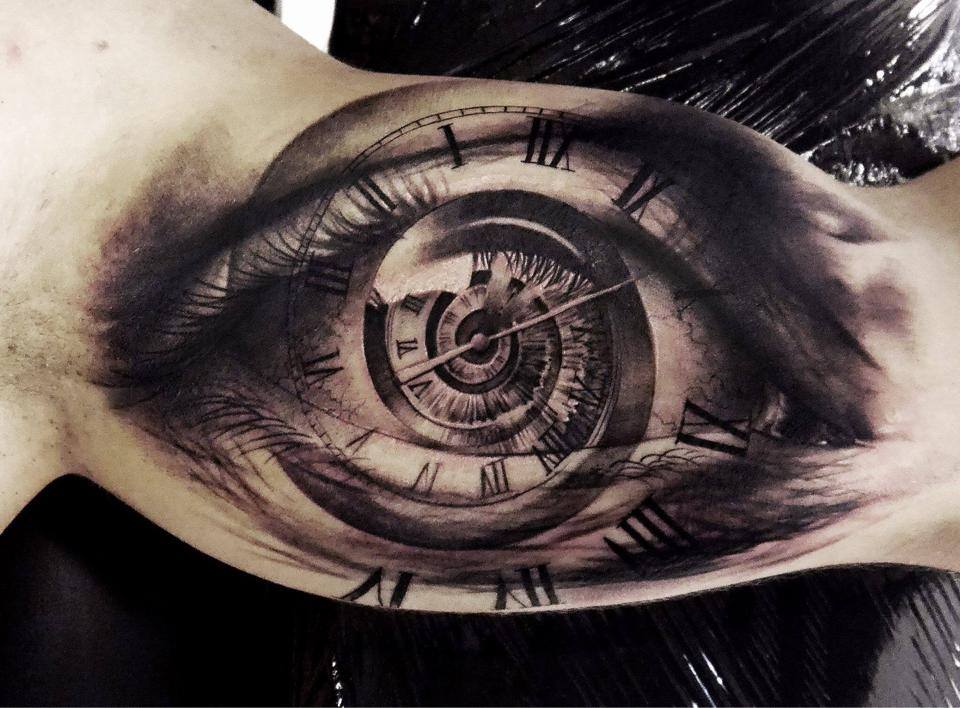 Unique Black Clock In Eye Tattoo On Bicep
