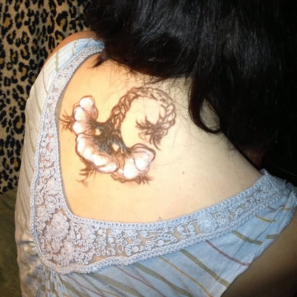 Unique Garlic Tattoo In Girl Upper Back